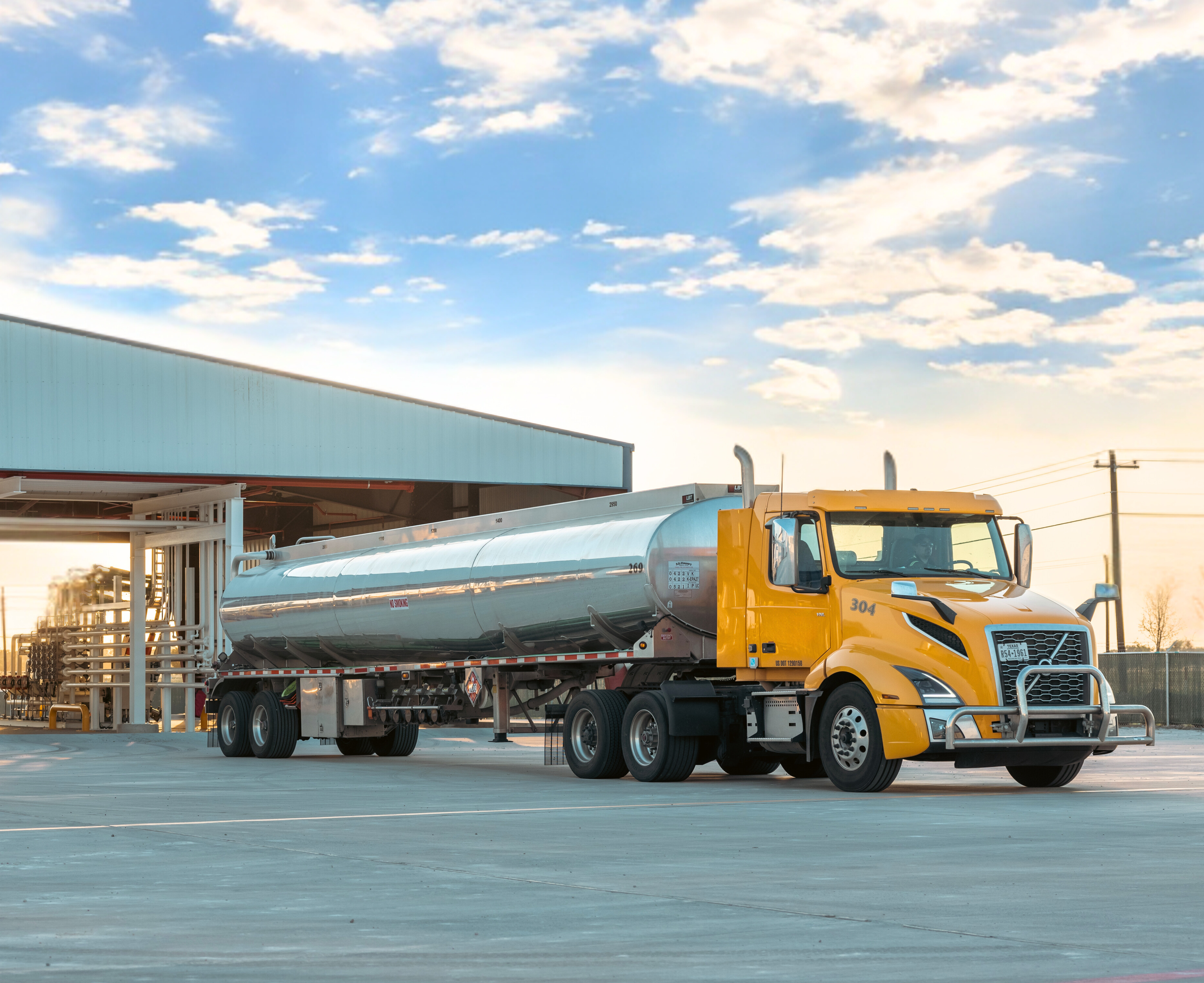 Unbranded fuel truck driver pulling away from U.S. Energy's refined products terminal