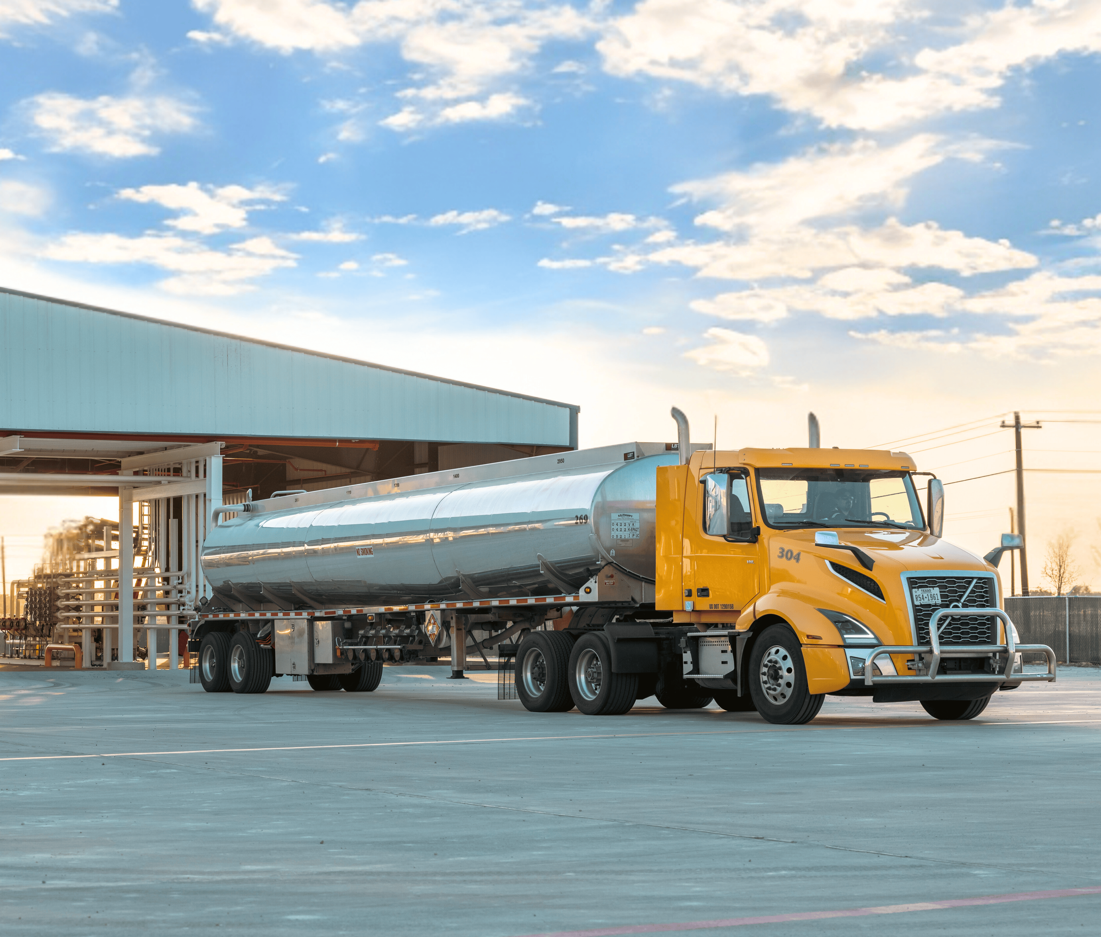 Unbranded fuel truck driver pulling away from U.S. Energy's refined products terminal
