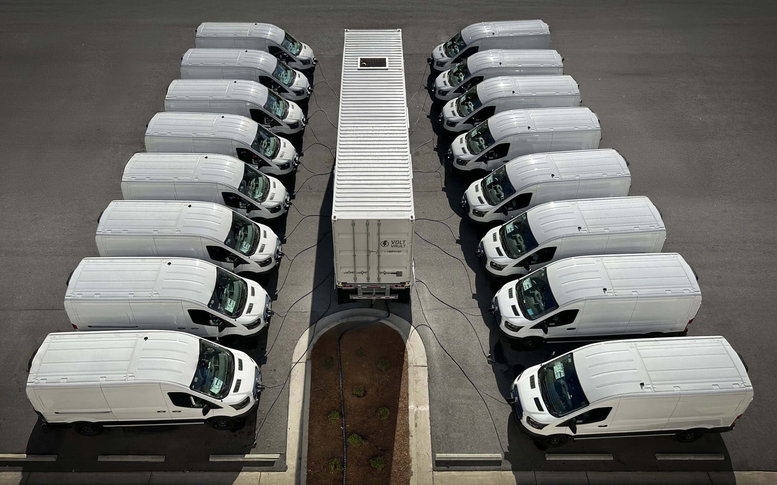 EV fleet of 16 delivery vans charging with U.S. Energy's Level 2 Volt Vault electric vehicle charger.